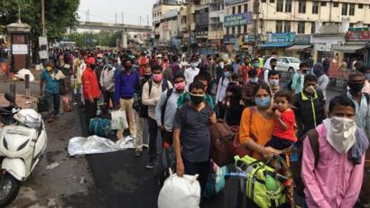 India coronavirus: Huge crowds as some train services resume