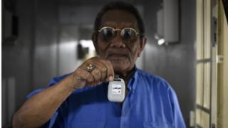 Singapore hands out coronavirus tracing devices