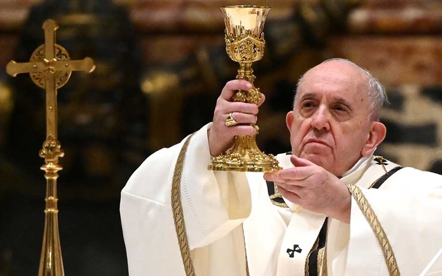 Pope urges help for poor at low-key Christmas Eve Mass curbed by COVID