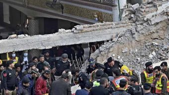 Families look for loved ones as Pakistan mosque blast toll kills 100
