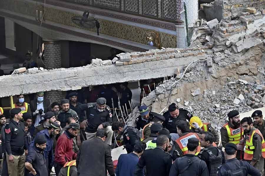 Families look for loved ones as Pakistan mosque blast toll kills 100