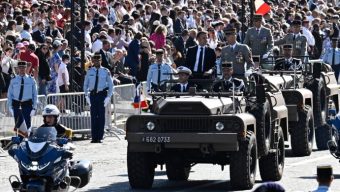 France celebrates national day amid political crisis